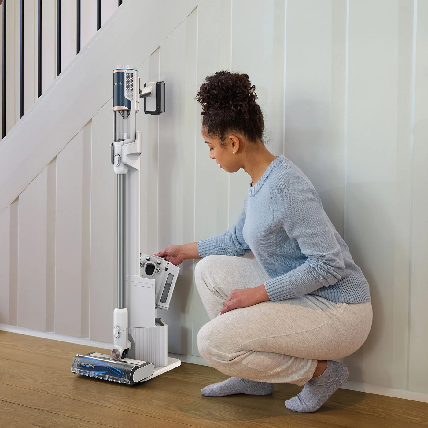 Shark-BU3521UK-InUse-Foyer-AutoEmptyBase-Removed-Woman